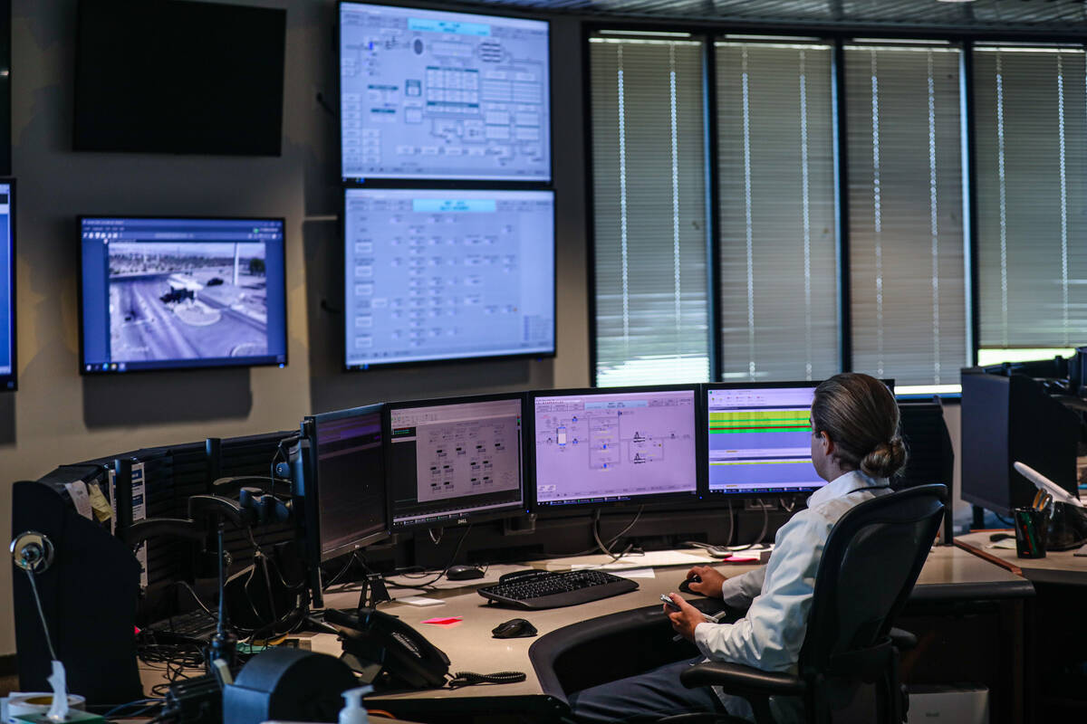 Joseph Eggers, a water treatment operator, works in the control room at the River Mountain Wate ...