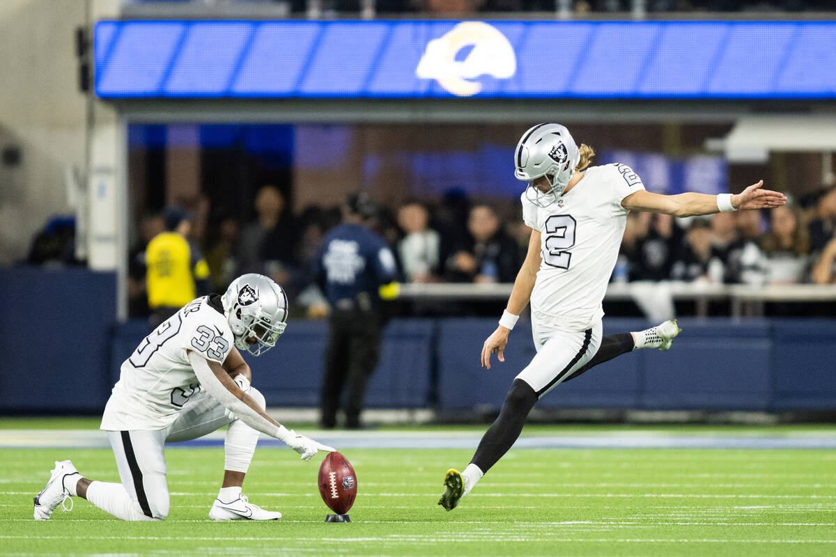 Las Vegas Raiders place kicker Daniel Carlson (2) kicks during an NFL football game against the ...