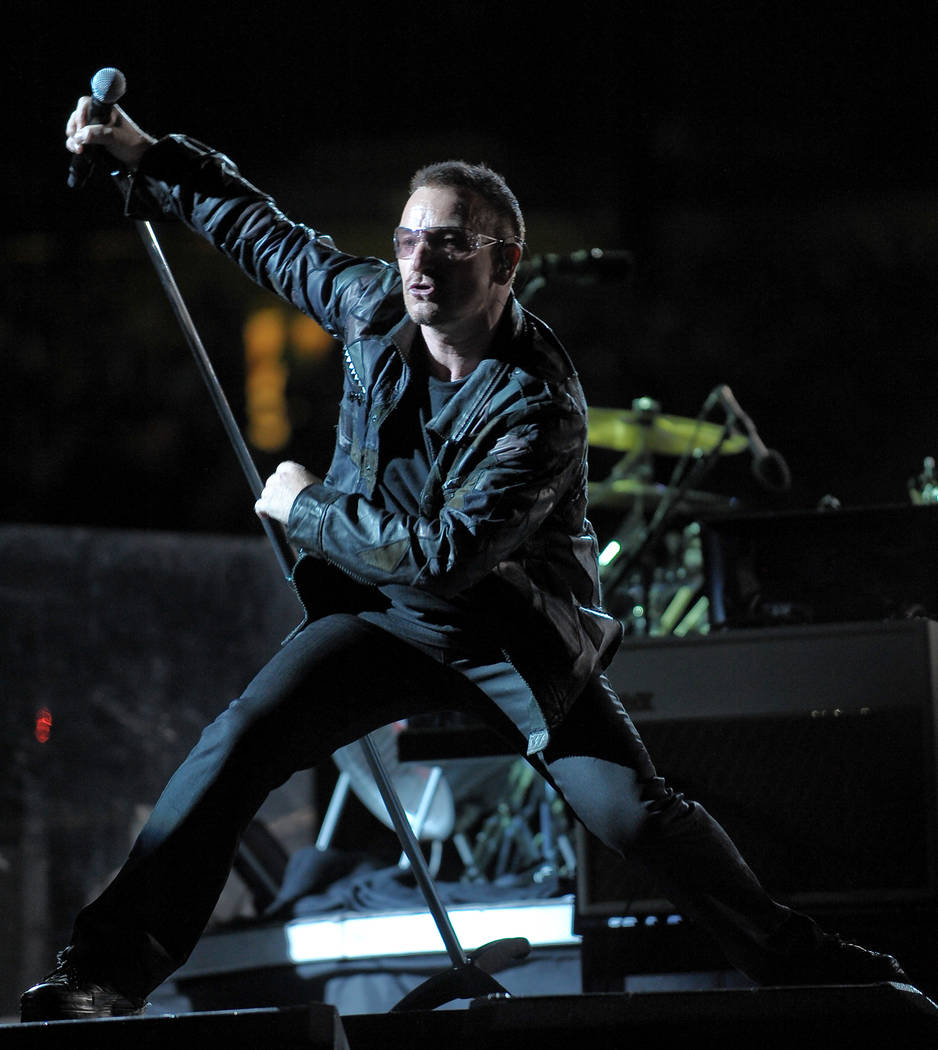 Lead singer Bono of the rock band U2 performs with the band during their 360 world tour stop at ...