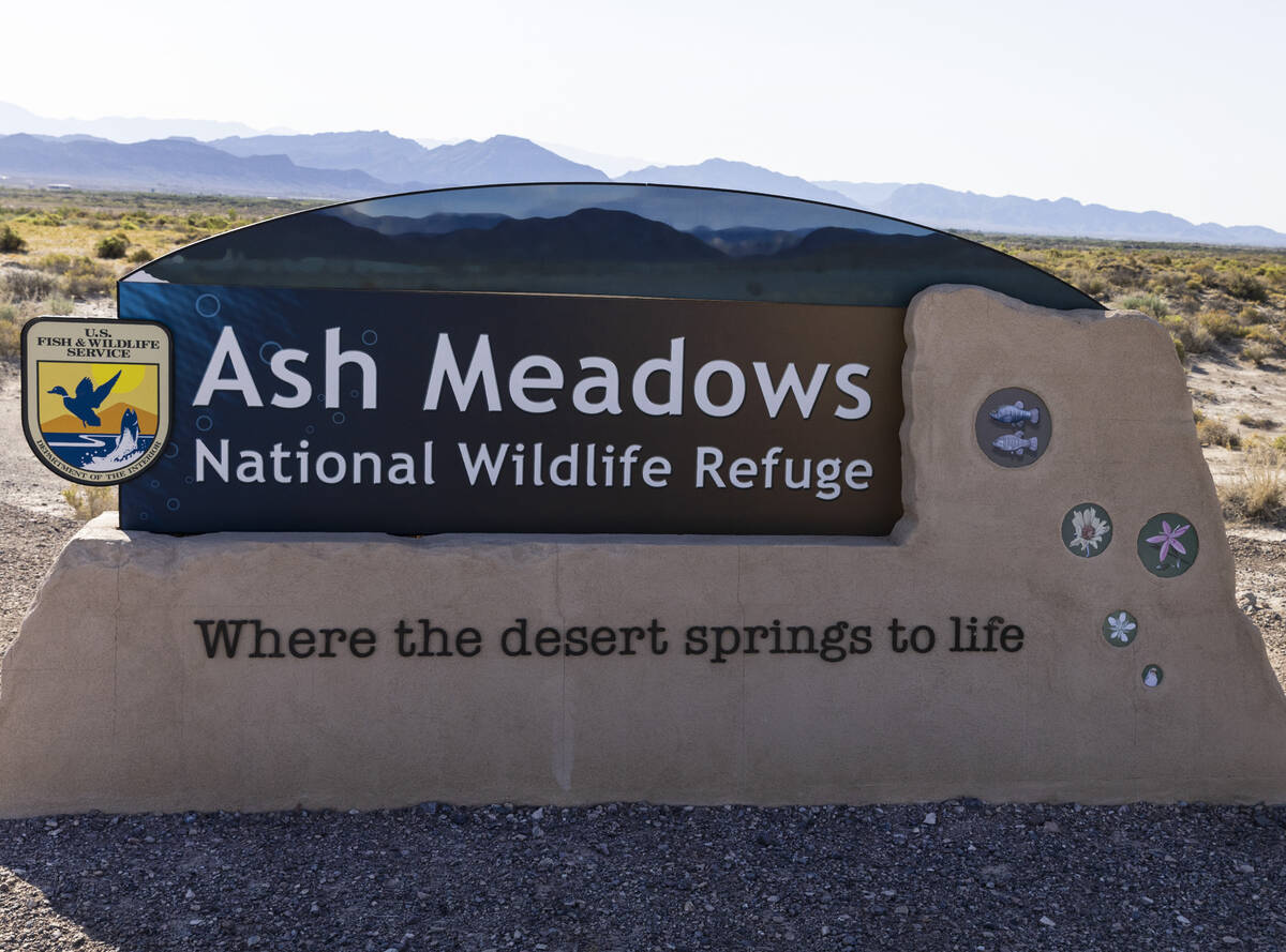 An Ash Meadows National Wildlife Refuge sign is seen in the Amargosa Valley of southern Nye Cou ...