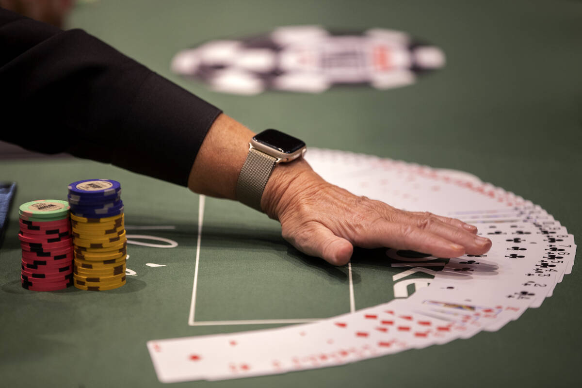 A dealer straightens their table during the first day of the World Series of Poker at Horseshoe ...