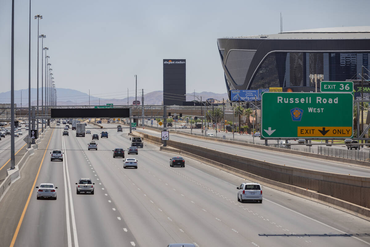 An active traffic management sign is seen on southbound Interstate 15 near Allegiant Stadium in ...