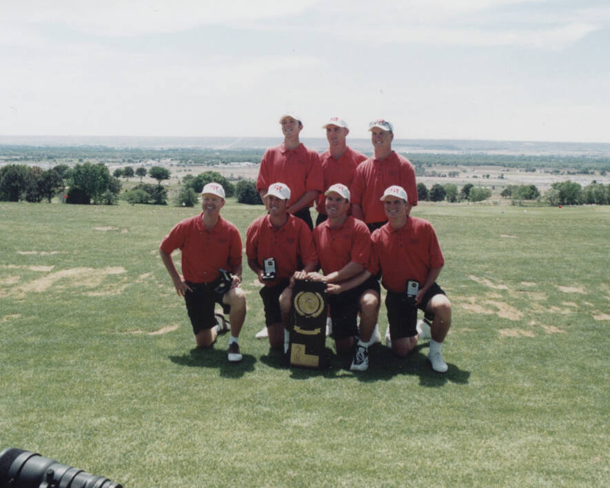 Members of the 1998 UNLV men's golf team with the NCAA championship trophy, front from left, co ...