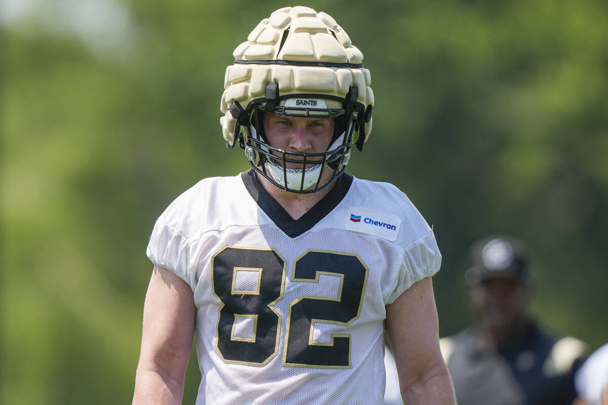 New Orleans Saints tight end Foster Moreau (82) walks between drills during NFL football practi ...