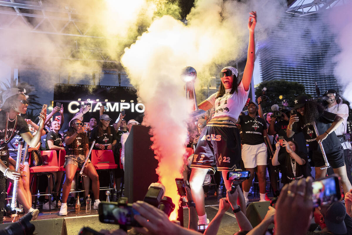 Las Vegas Aces forward and 2022 WNBA MVP A'ja Wilson, holding the 2022 WNBA Championship trophy ...