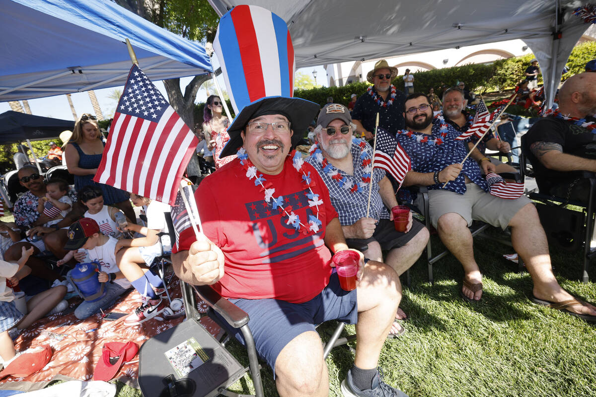 Albert Ronquillo of Summerlin holds an American flag during the annual Summerlin Council Patrio ...