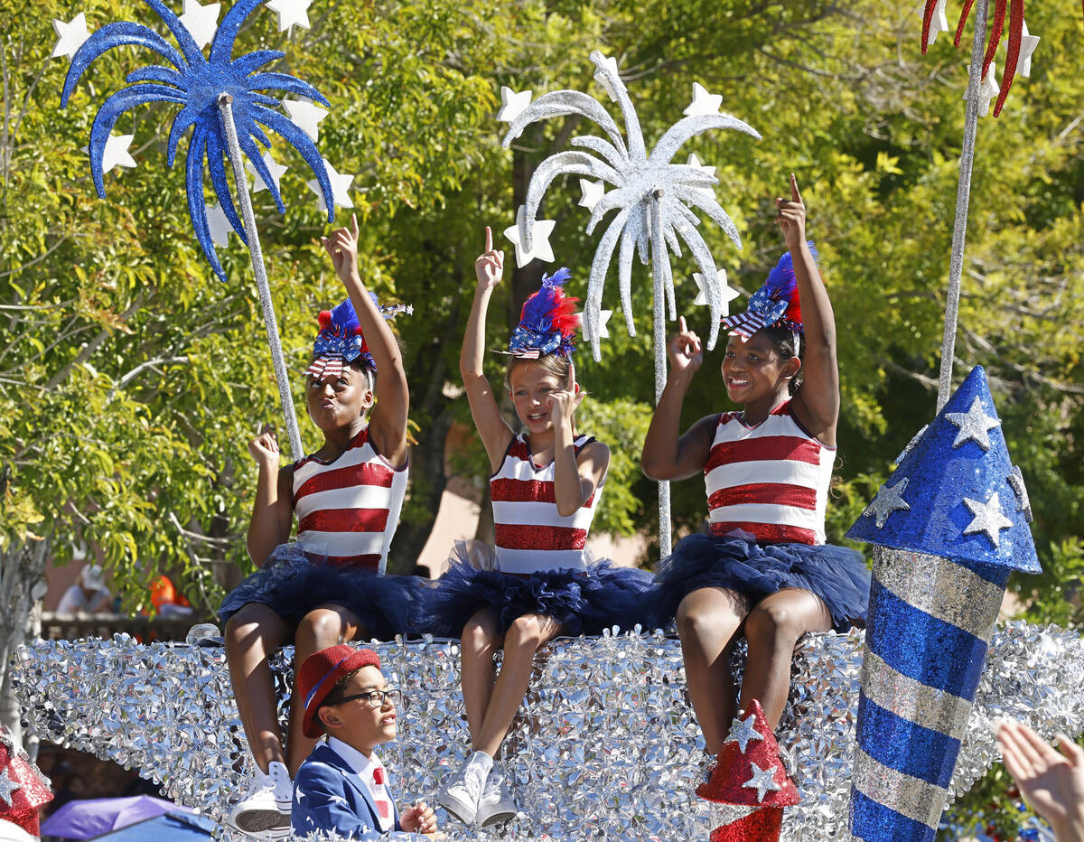 Children perform on the “Schoolhouse Rock!” float during the annual Summerlin Cou ...