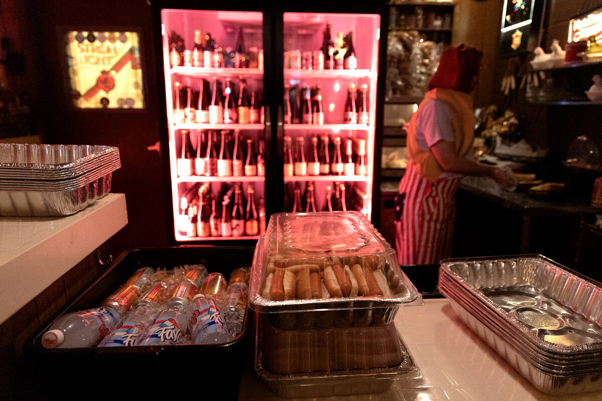 Owner Rose Signor, right, prepares some of the 120 hot dogs for their third annual Fourth of Ju ...