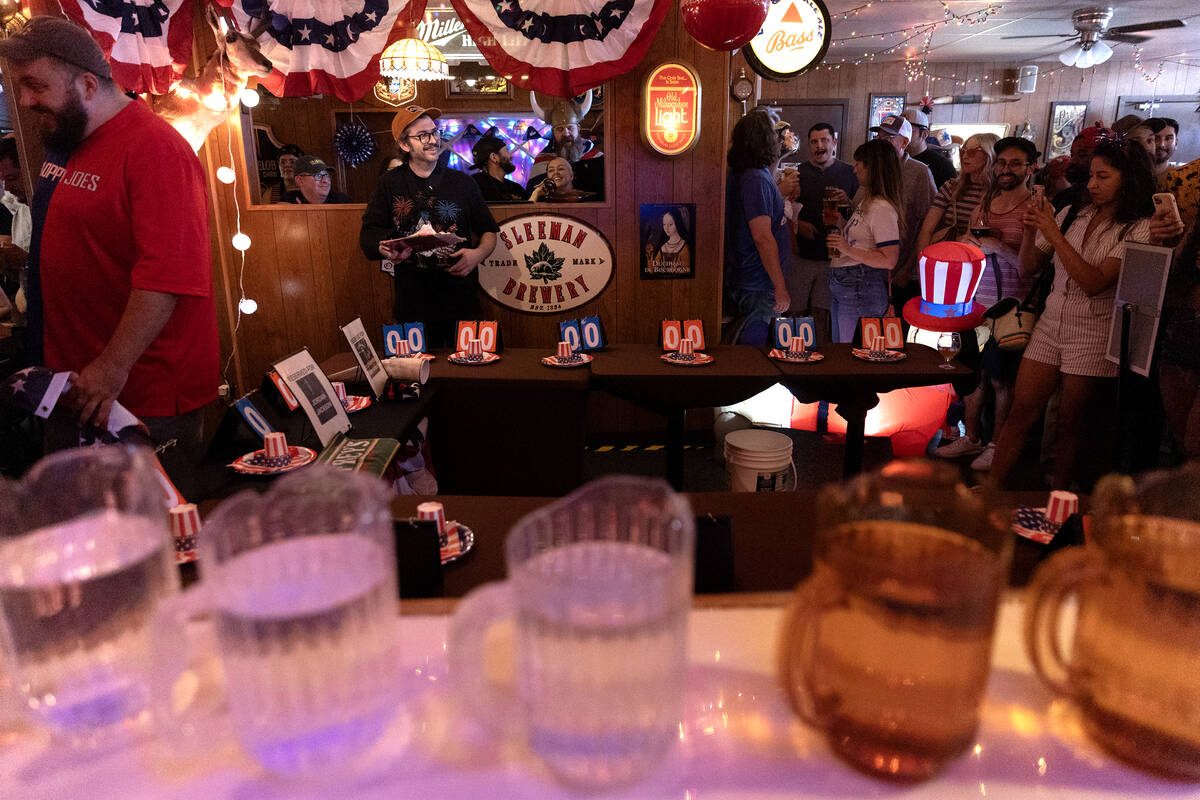 Owner Andrew Smith, back left, prepares for the third annual Fourth of July hot dog eating cont ...