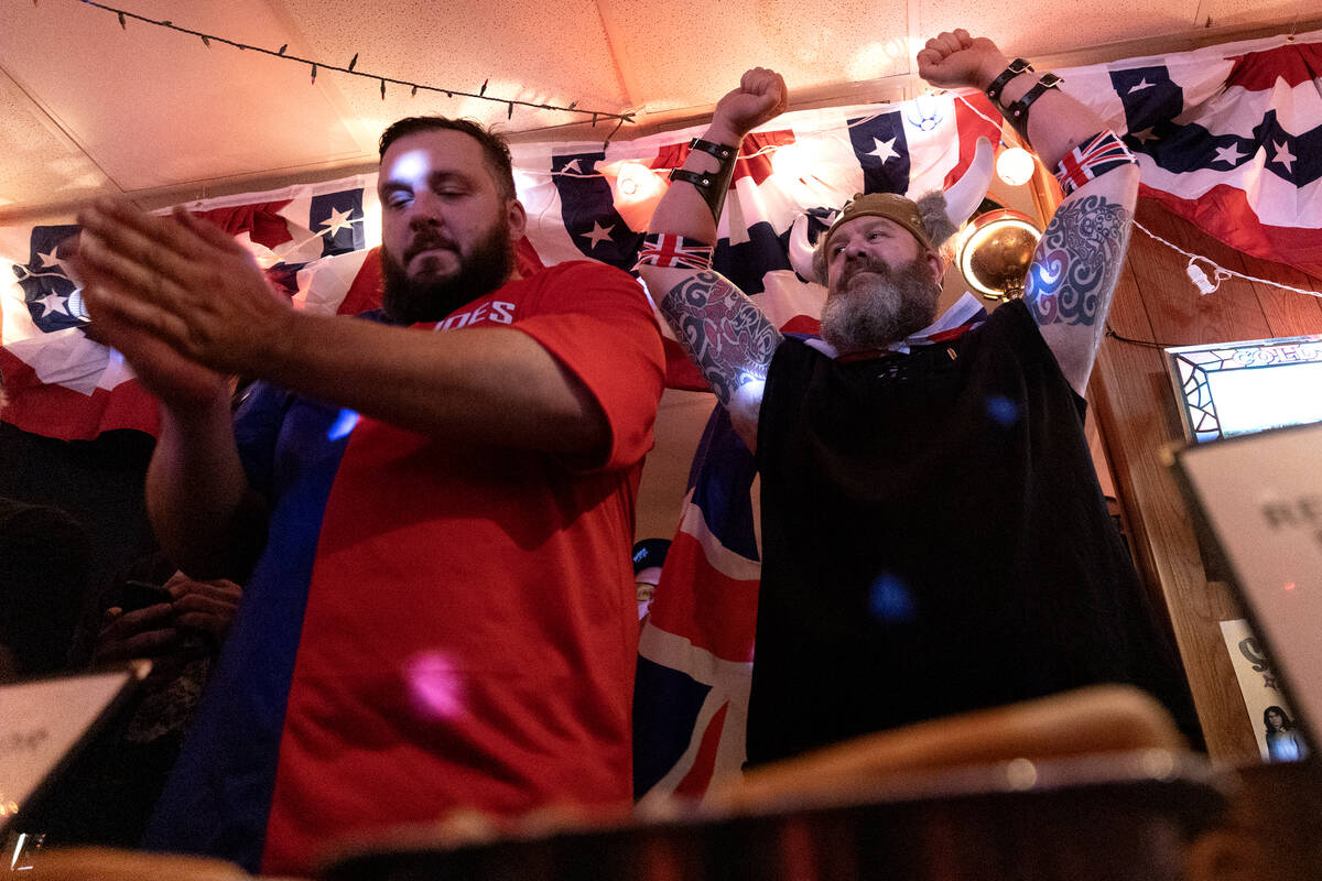 Jordan Jackson, left, and Mark Hirst, two-time champion in previous contests, cheer during the ...