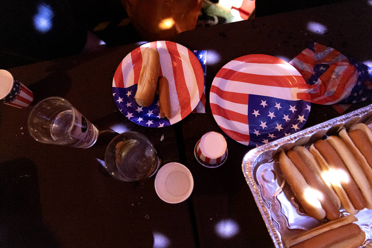 The aftermath of the third annual Fourth of July hot dog eating contest is left on tables at Th ...