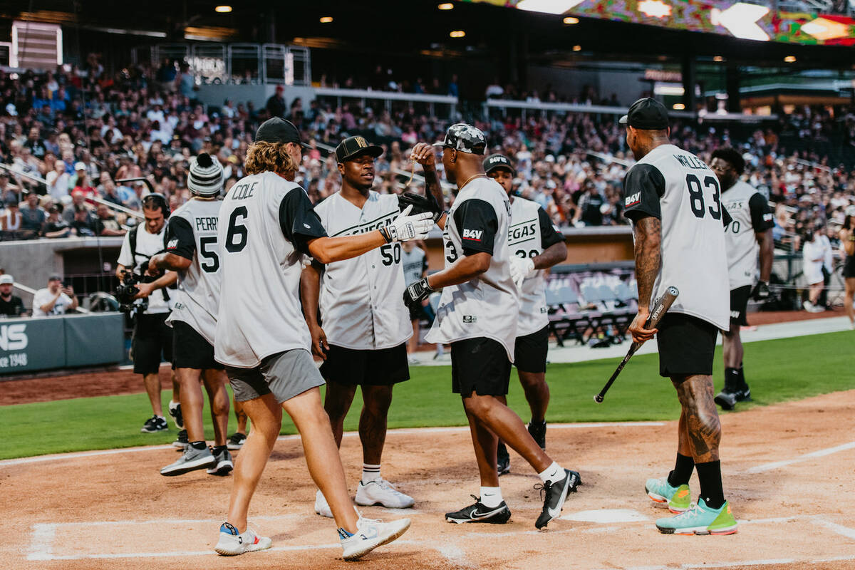 Team Reilly Smith and VGK players vs. Team Maxx Crosby and Las Vegas Raiders players and friend ...