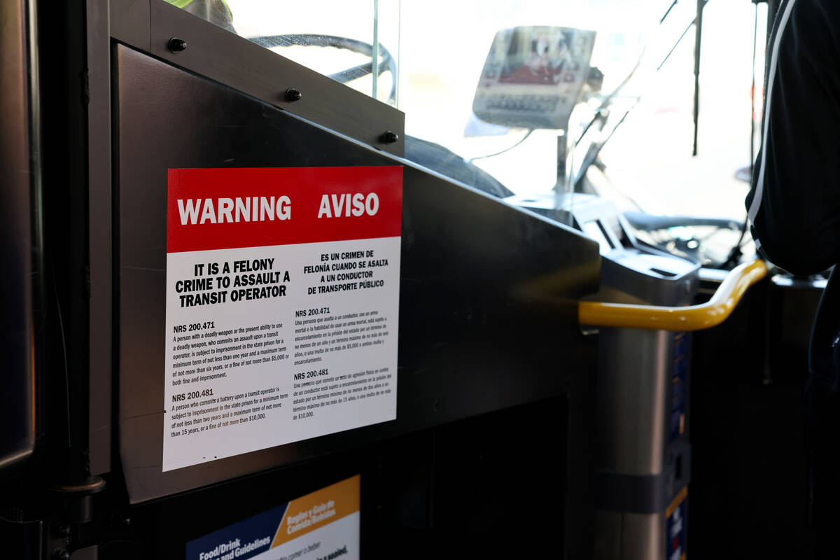 A sign warning against assaults on bus drivers is seen on a Regional Transportation Commission ...