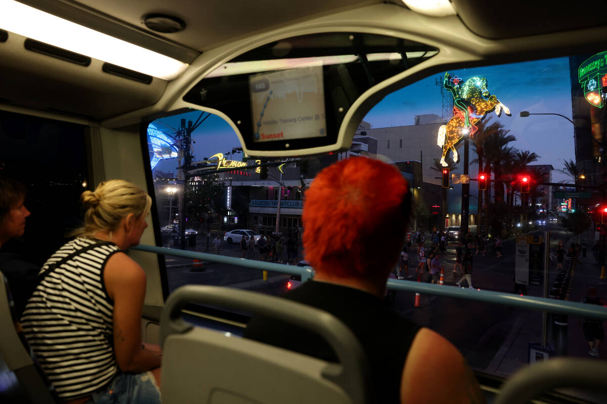 Passengers ride a Regional Transportation Commission bus on Las Vegas Boulevard at Fremont Stre ...