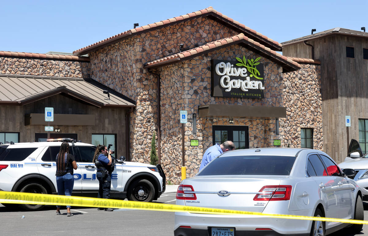 North Las Vegas Police investigate the scene where a 6-year-old girl and man in his 30s were sh ...