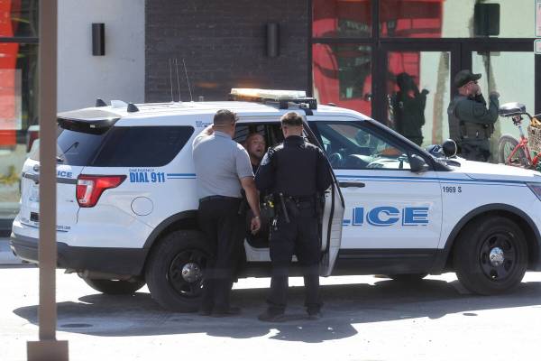 North Las Vegas Police talk to Zachary Stern near the scene where a 6-year-old girl and man in ...