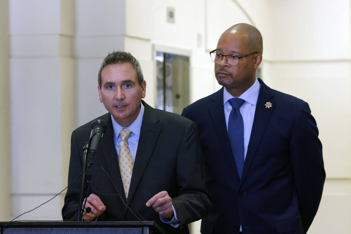 Mark Krueger, Nevada chief deputy attorney general with Bureau of Consumer Protection, left, an ...