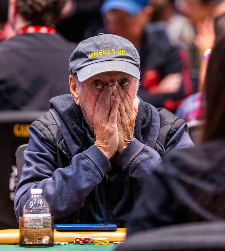 A player reacts to cards being laid down during the final starting flight of World Series of Po ...