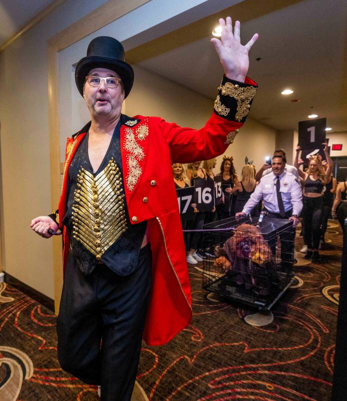 Phil Hellmuth as the “The Greatest Showman!" pulls a cage with Daniel "Junglem ...