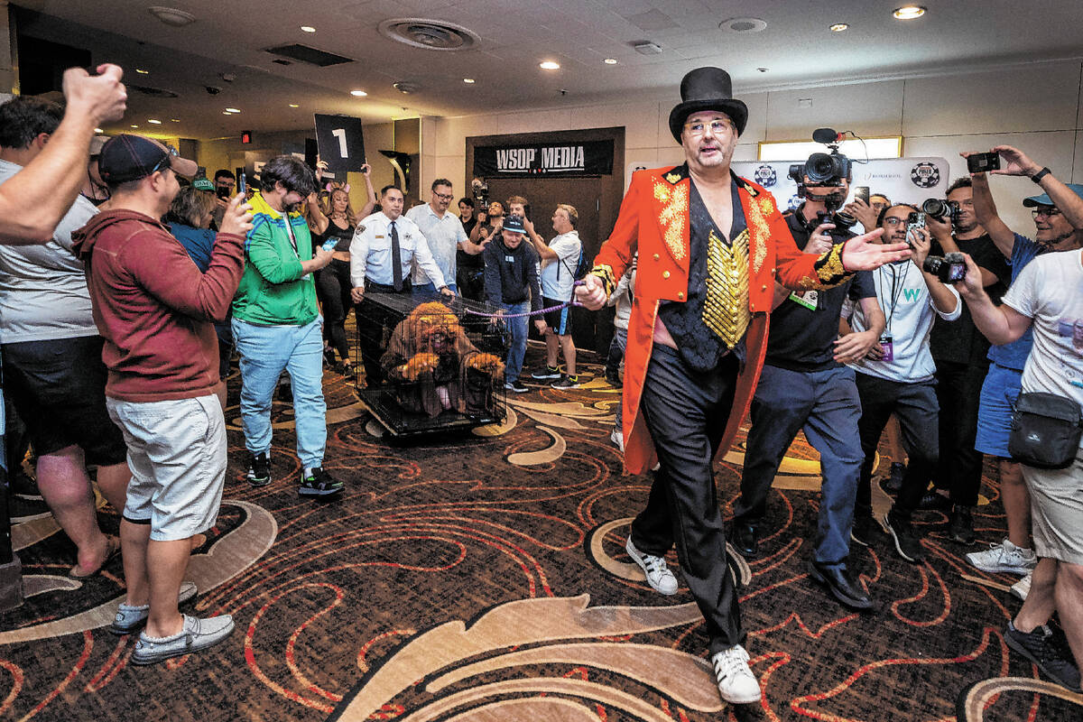 Phil Hellmuth as the “The Greatest Showman!" pulls a cage with Daniel "Junglem ...