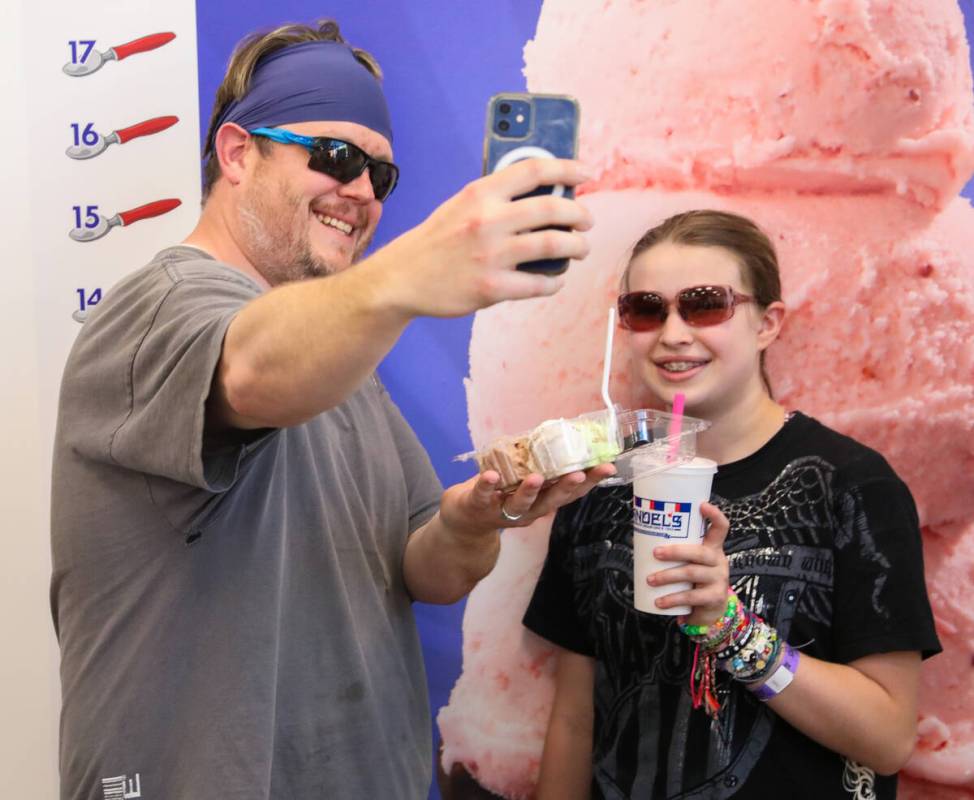 Allison and Derek Campbell take a selfie with their ice cream during the grand opening of Las V ...