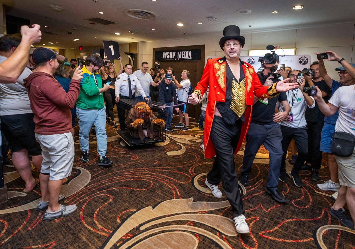 Phil Hellmuth as the “The Greatest Showman!" pulls a cage with Daniel "Junglem ...