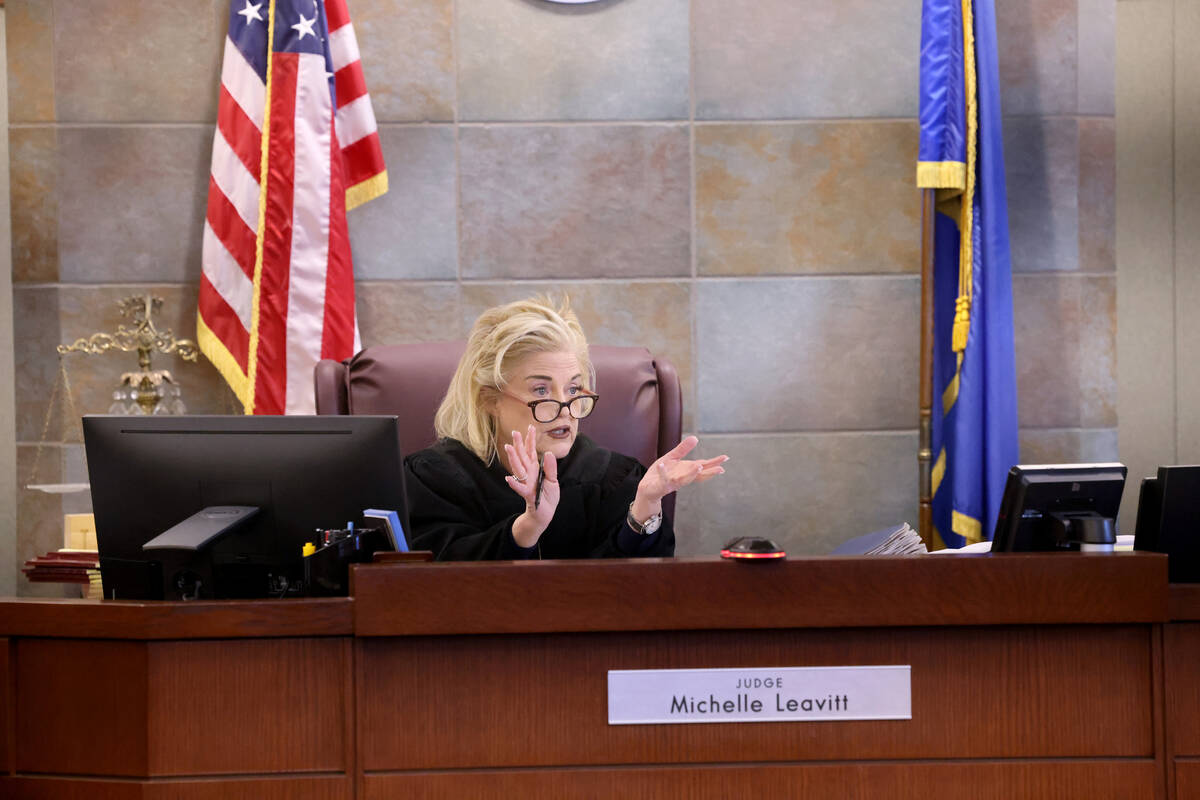 Clark County District Judge Michelle Leavitt converses with former Clark County Public Administ ...