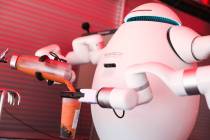 Adam the robot prepares a customer’s boba tea at Cloutea, the first boba tea store run b ...