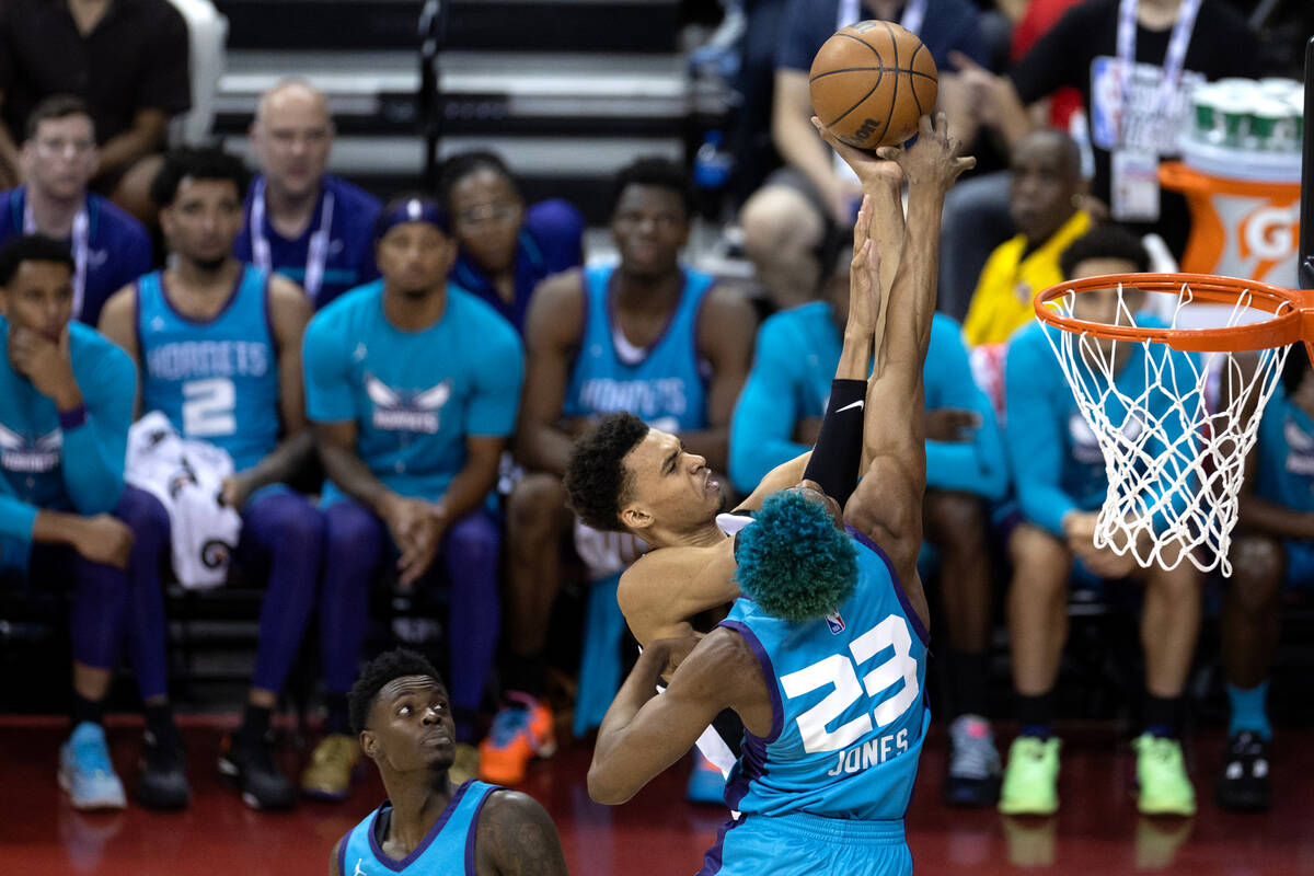 San Antonio Spurs forward Victor Wembanyama (1) shoots against Charlotte Hornets forward/center ...