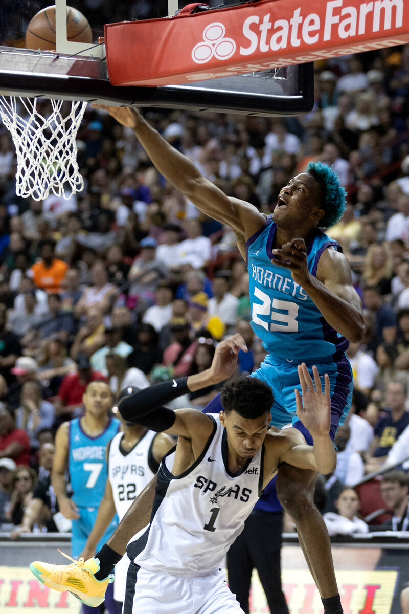 Charlotte Hornets forward/center Kai Jones (23) dunks on San Antonio Spurs forward Victor Wemba ...