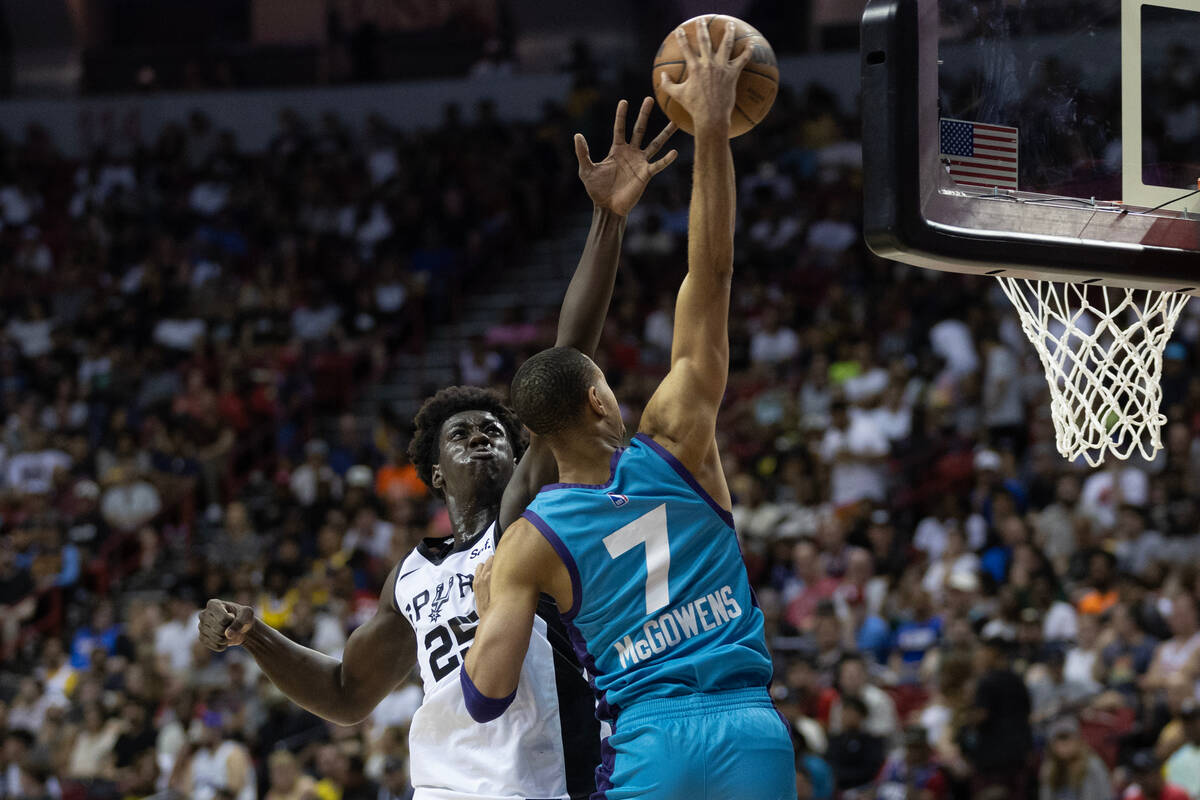 San Antonio Spurs guard/forward Sidy Cissoko (25) attempts to block Charlotte Hornets guard/for ...