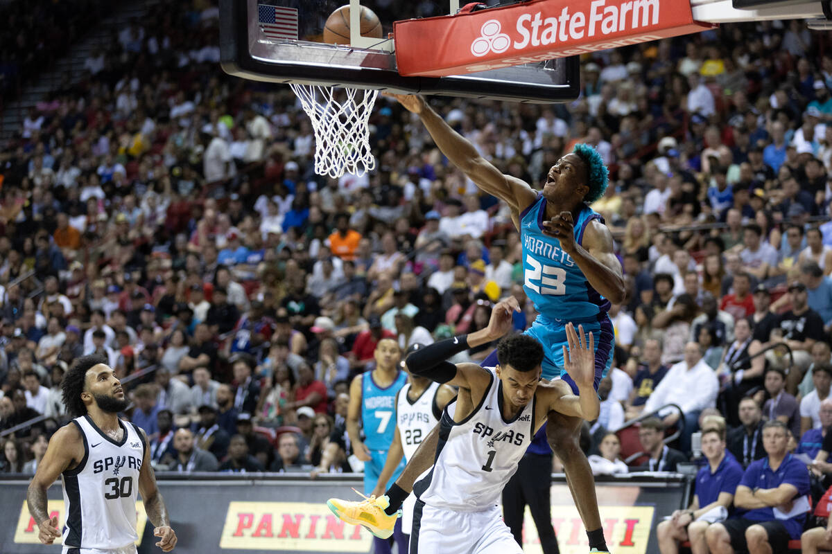 Charlotte Hornets forward/center Kai Jones (23) dunks on San Antonio Spurs forward Victor Wemba ...