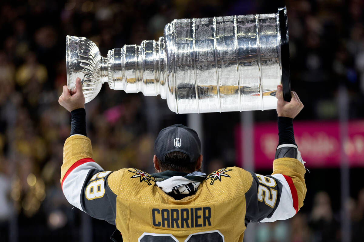 Golden Knights left wing William Carrier (28) celebrates with the Stanley Cup after winning the ...