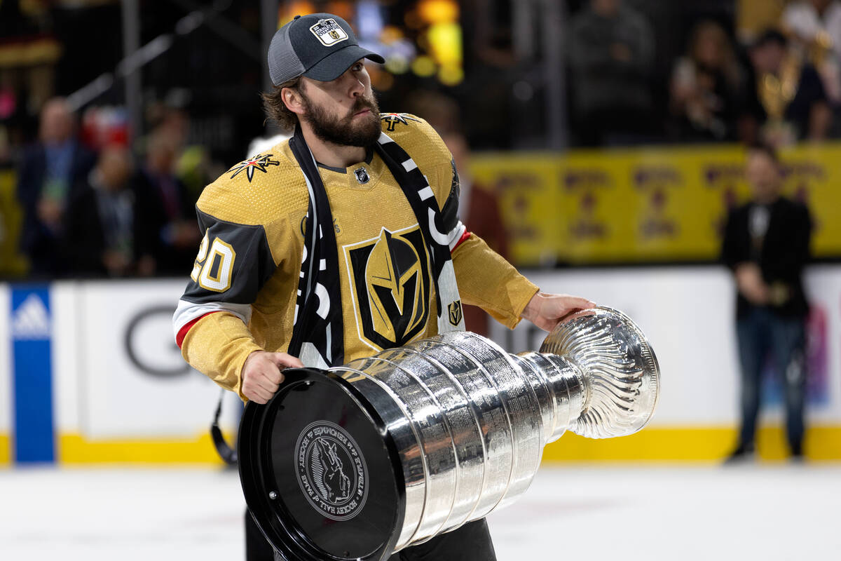 Golden Knights center Chandler Stephenson (20) celebrates with the Stanley Cup after winning th ...