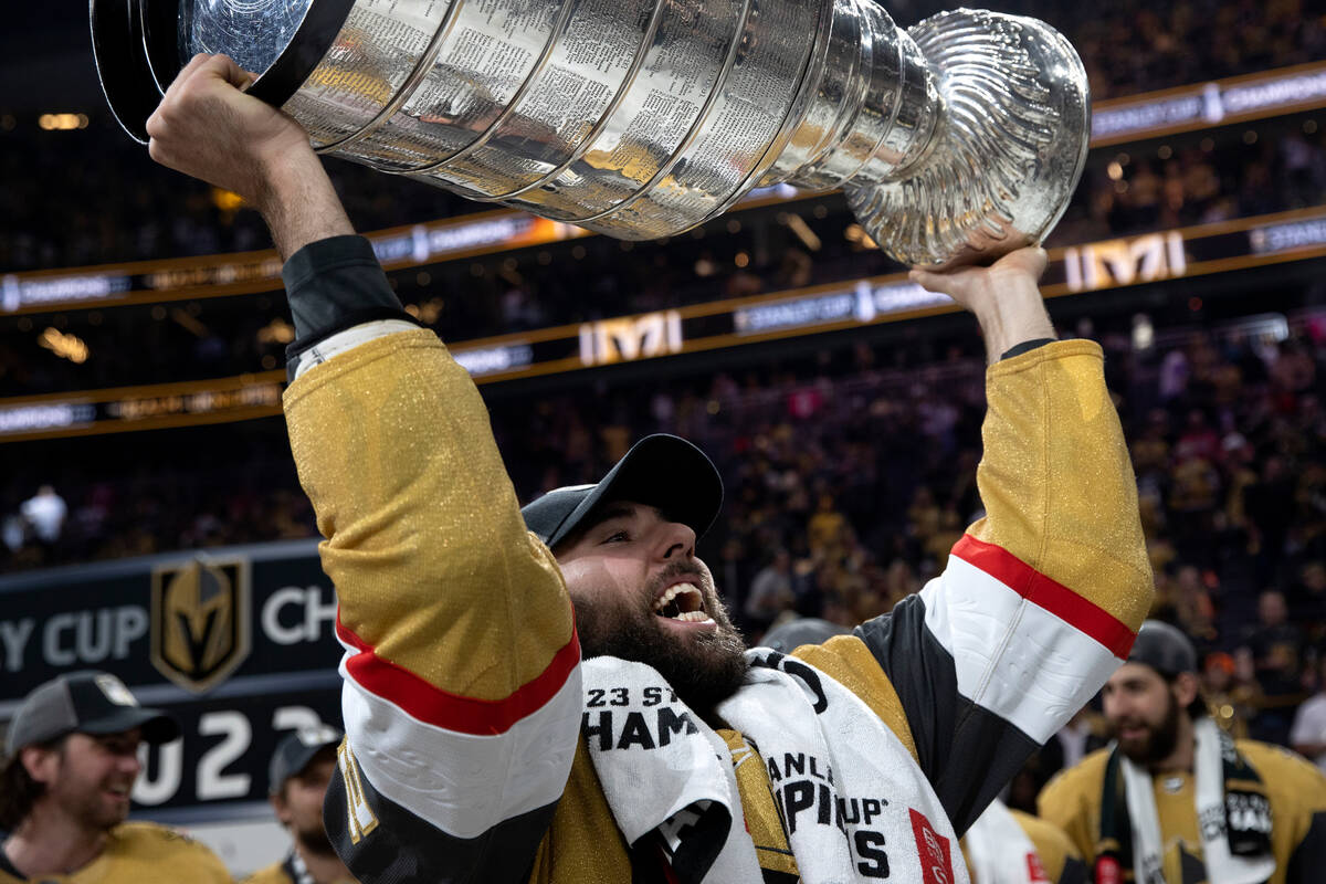 Golden Knights right wing Michael Amadio (22) celebrates with the Stanley Cup after winning the ...