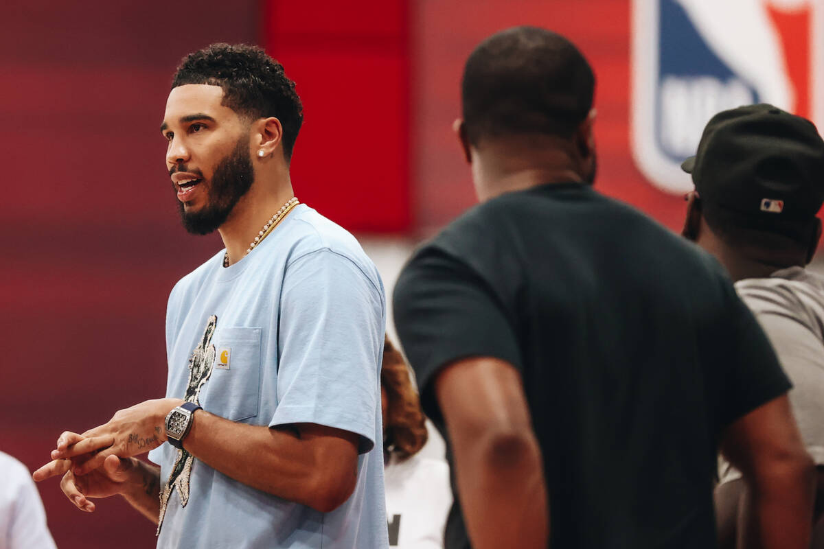 Boston Celtics forward Jayson Tatum speaks to friends during an NBA Summer League matchup betwe ...