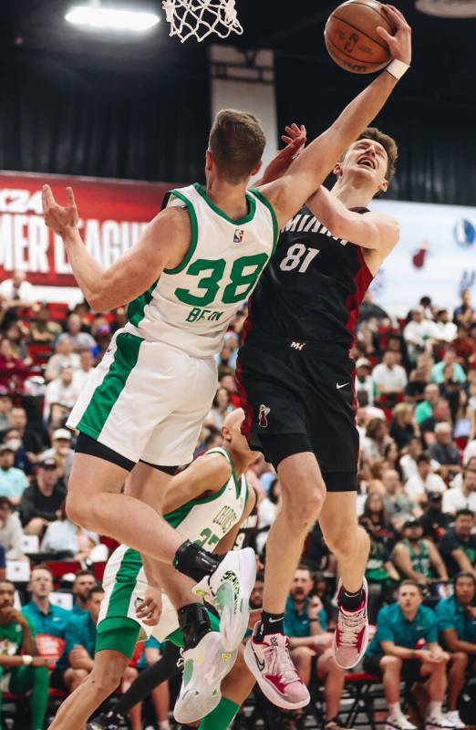 Miami Heat forward Drew Peterson (81) struggles to grab the ball for a rebound against Boston C ...