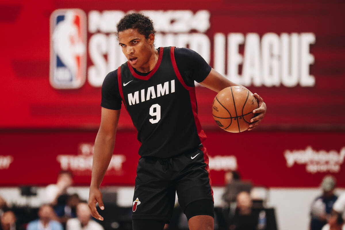 Miami Heat guard Dru Smith dribbles the ball down the court during an NBA Summer League game ag ...