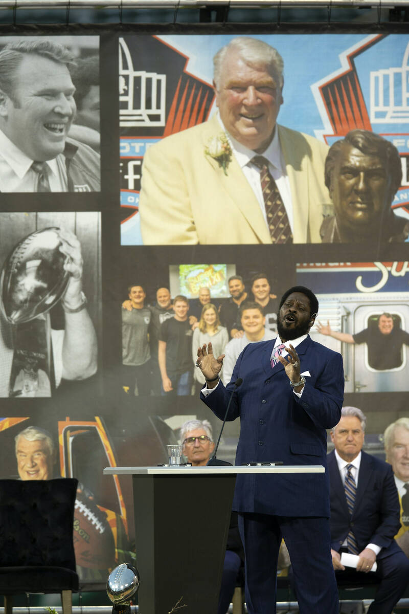 Former Oakland Raiders player Henry Lawrence sings "Amazing Grace" during a memorial ...