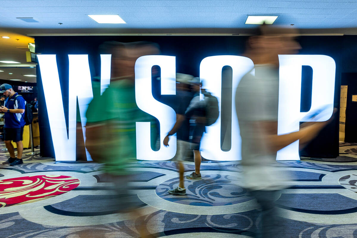 Attendees stream about during the final starting flight of World Series of Poker $10,000 buy-in ...