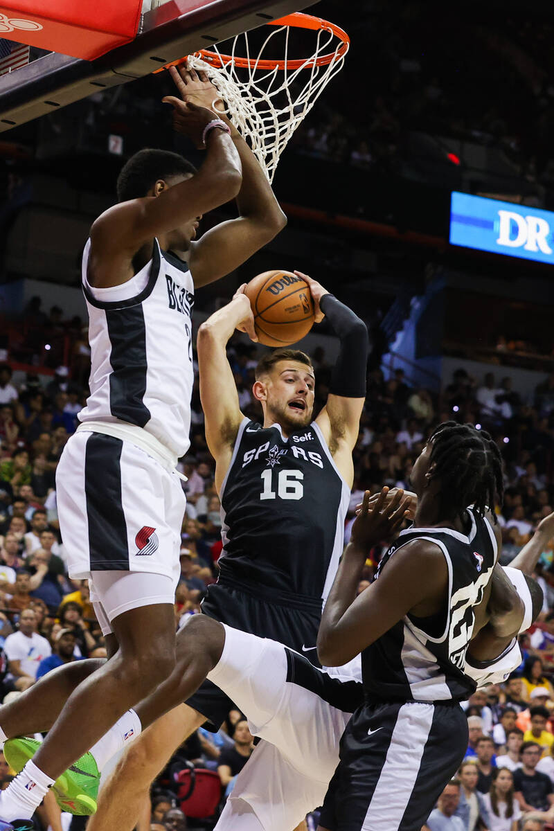 San Antonio Spurs guard Erik Stevenson (16) gets the rebound during an NBA Summer League game a ...