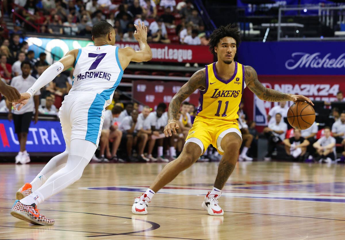 Los Angeles Lakers guard Jalen Hood-Schifino (11) dribbles the ball down the court during an NB ...