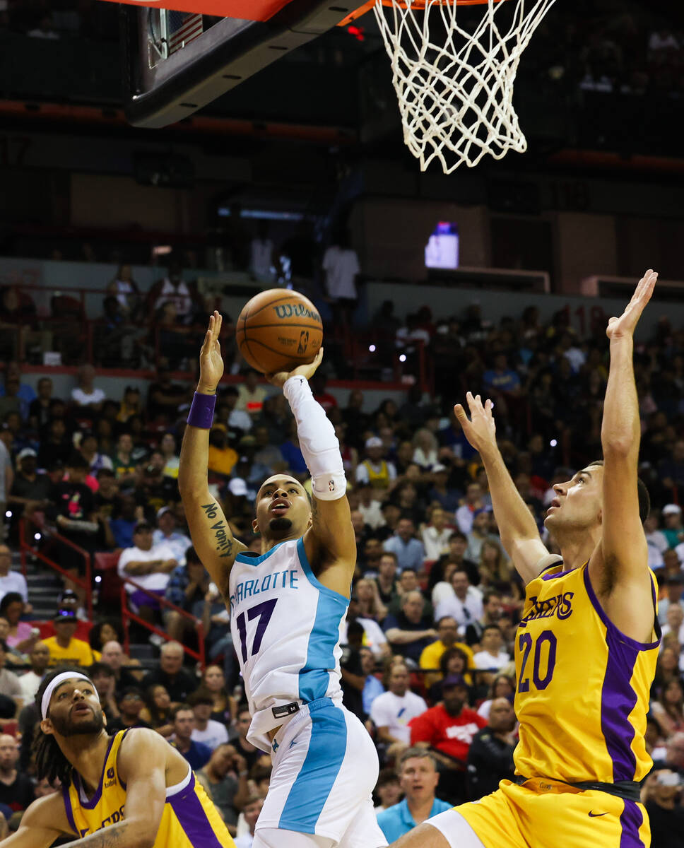 Charlotte Hornets guard Amari Bailey (17) takes a shot against Los Angeles Lakers forward Cole ...