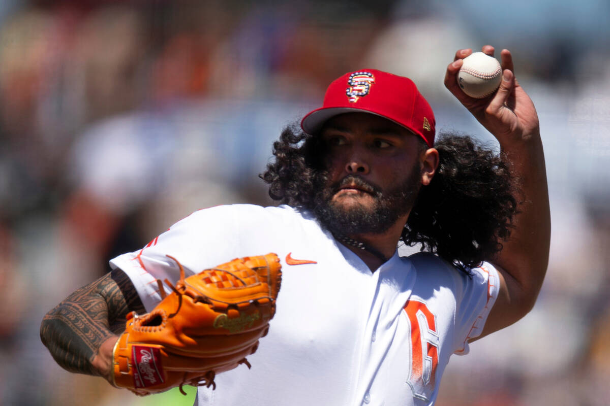 San Francisco Giants pitcher Sean Manaea (52) delivers against the Seattle Mariners during the ...