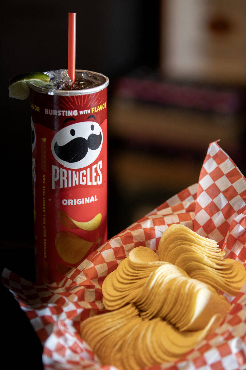 “The Fletcher,” a rum and coke served in a Pringles can, with the chips on the si ...
