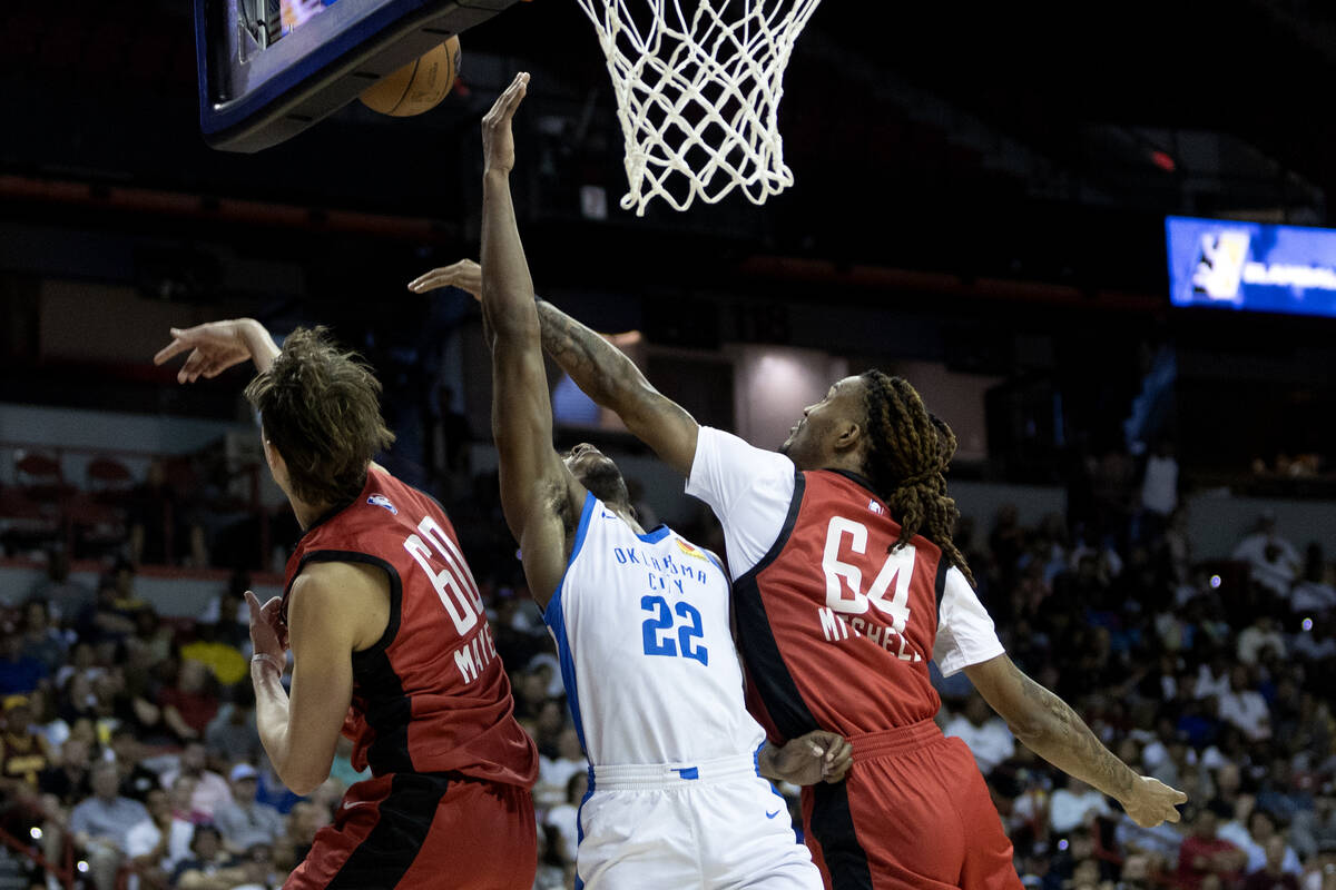 Houston Rockets forward Trhae Mitchell (64) blocks a shot by Oklahoma City Thunder guard Cason ...