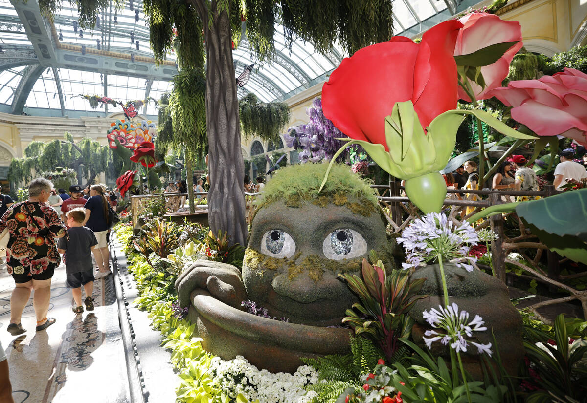 People walk through Bellagio’s Conservatory & Botanical Gardens, Tuesday, July 11, 2023, in L ...