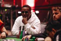 Maurice Hawkins smiles while competing in a card game during the World Series of Poker $10,000 ...