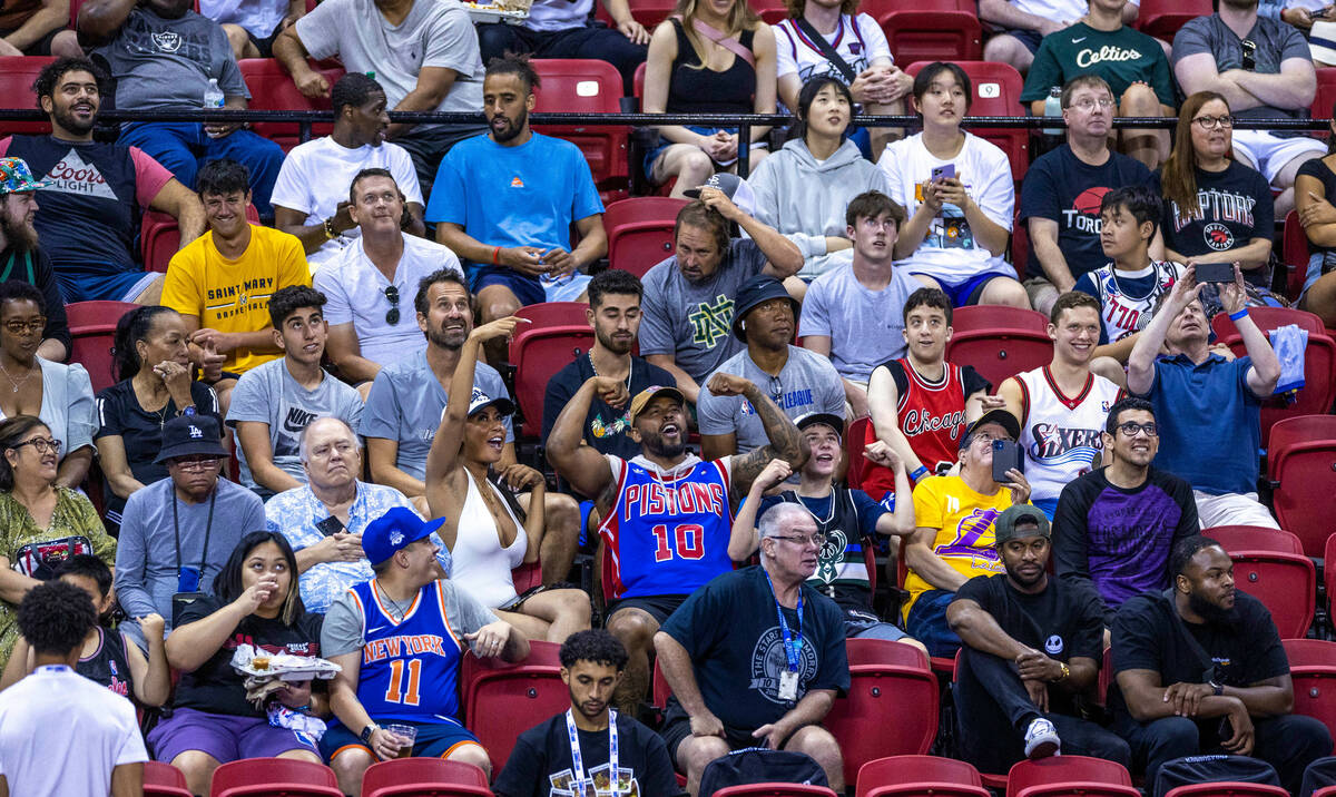 Fans have fun with the "flex cam" during an NBA Summer League game at the Thomas and ...