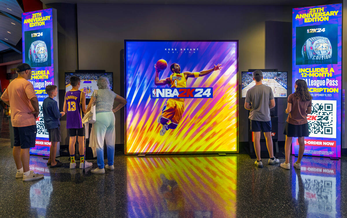 Fans play NBA2K24 in the concourse during the NBA Summer League at the Thomas and Mack Center o ...